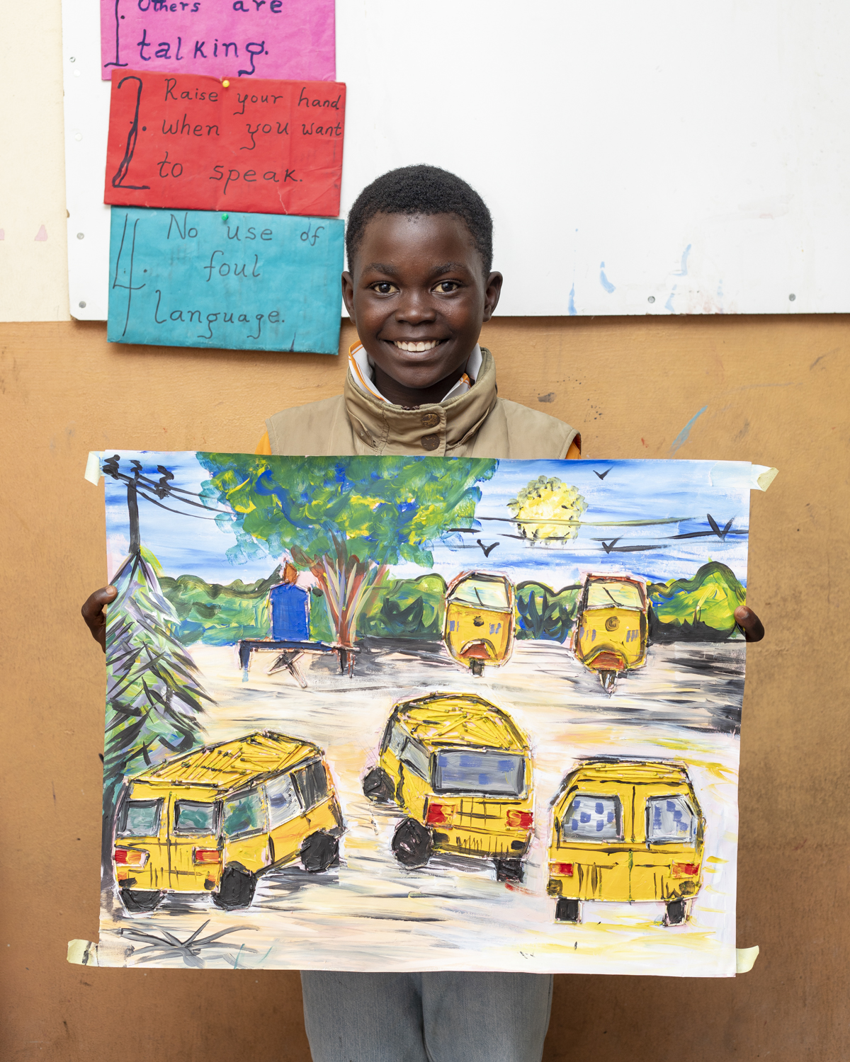 Student with handdrawn artwork at Summer School